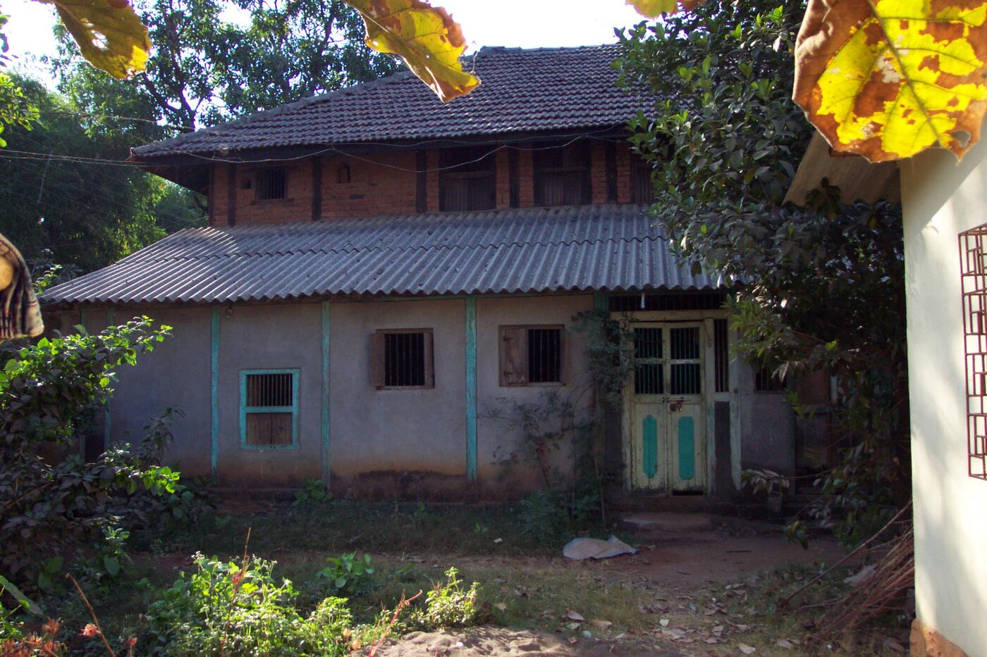 An older house in Birwadi framed by trees