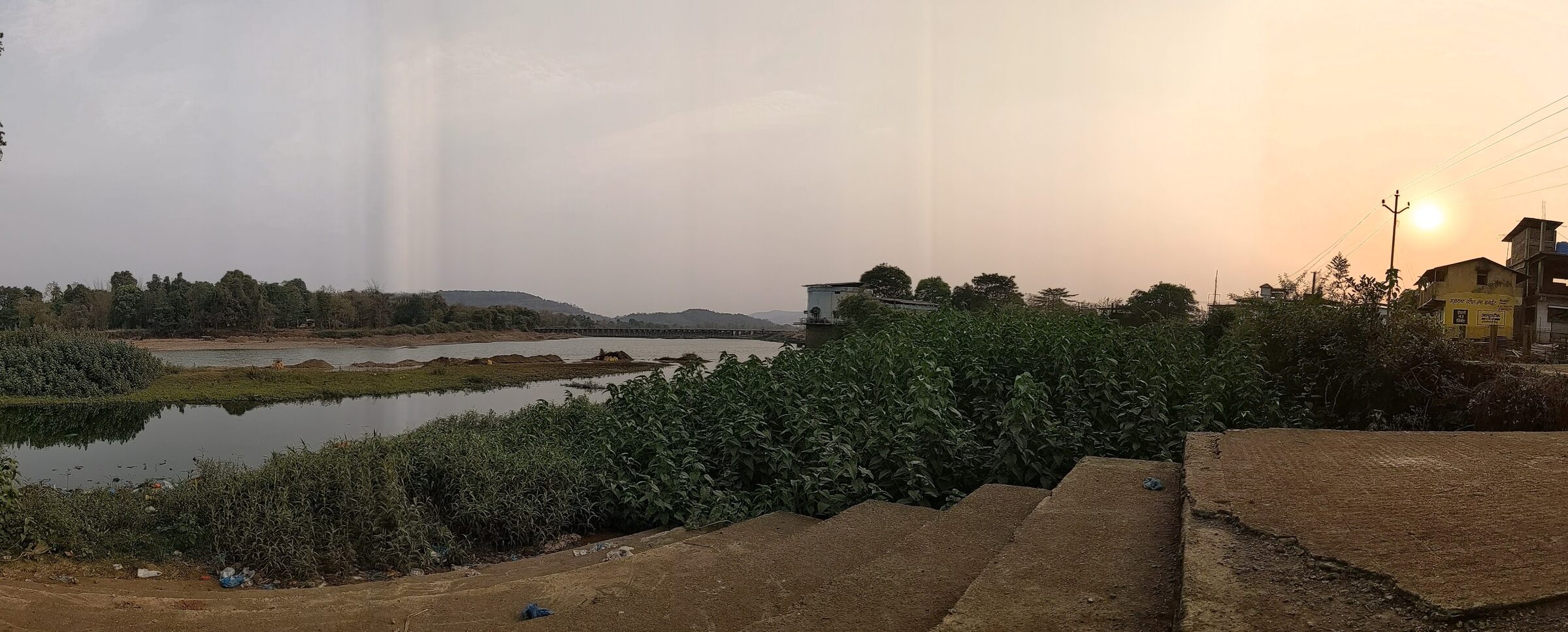 A riverbank view in Birwadi at sunset