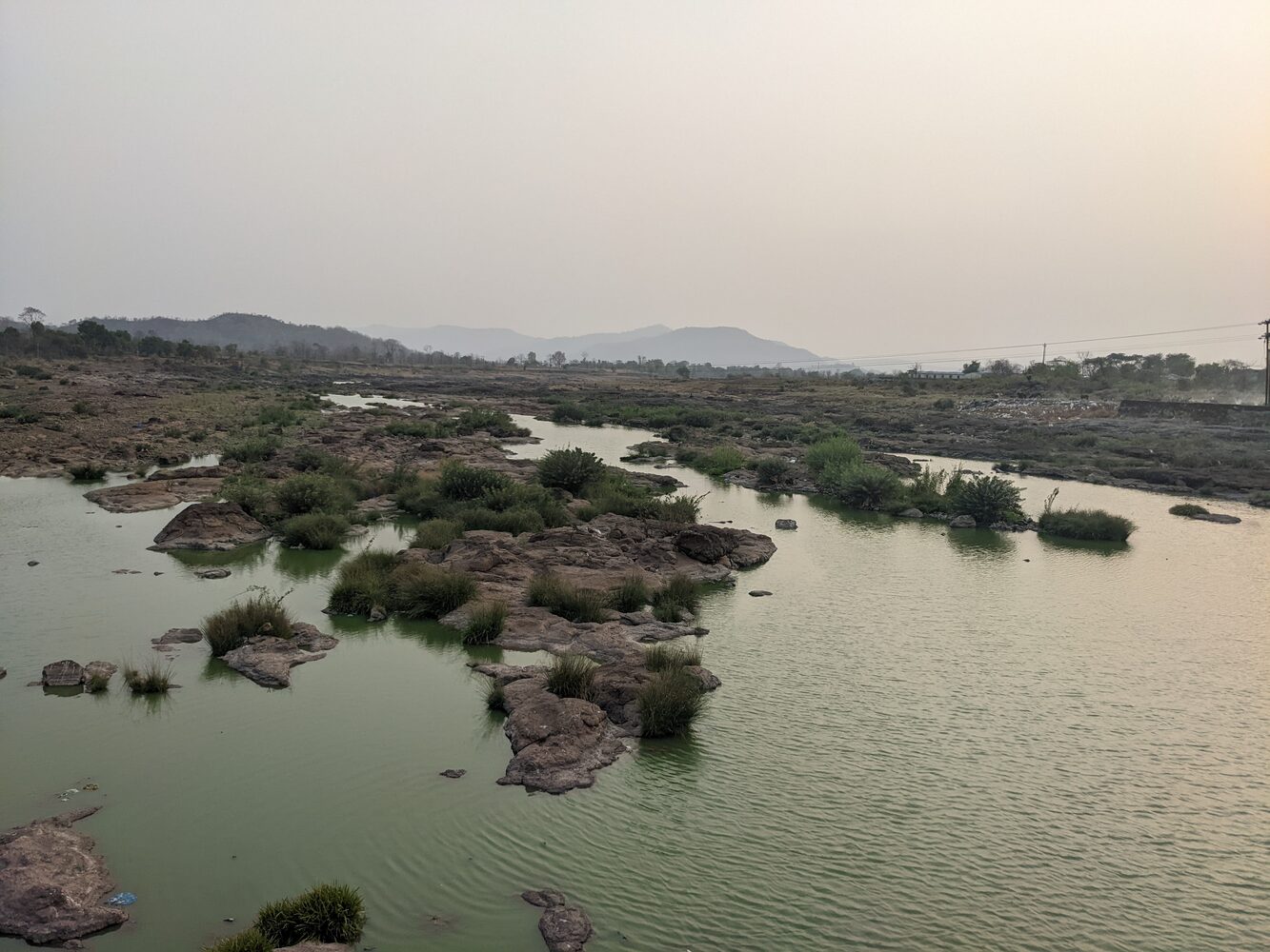 Rocky water and hills near Birwadi